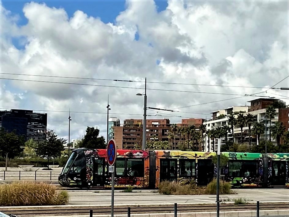 tram in front of apartment buildings in Port Marianne, Montpellier, France prime map dot location